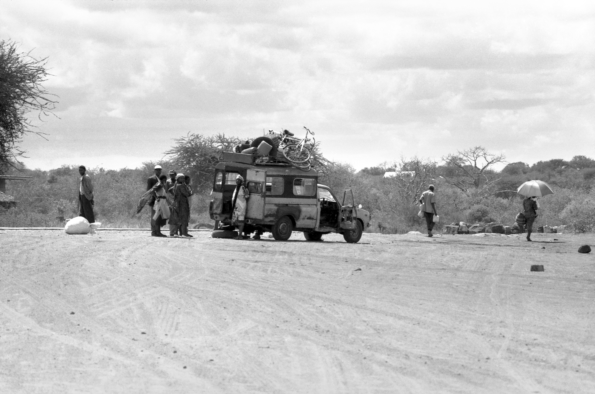 Matatu with a puncture, Kenya